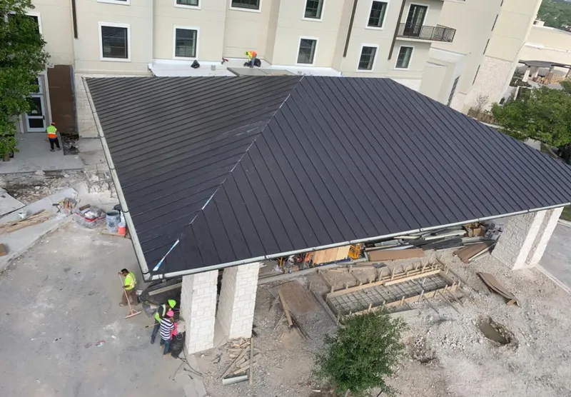 Metal roofing installation team working on a commercial building in Rahway